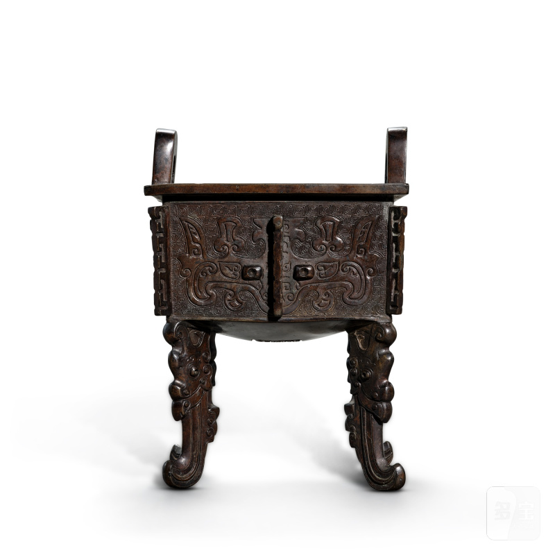A bronze archaistic 'mask' ding, Late Ming dynasty | 明晚期 仿古獸面紋銅鼎